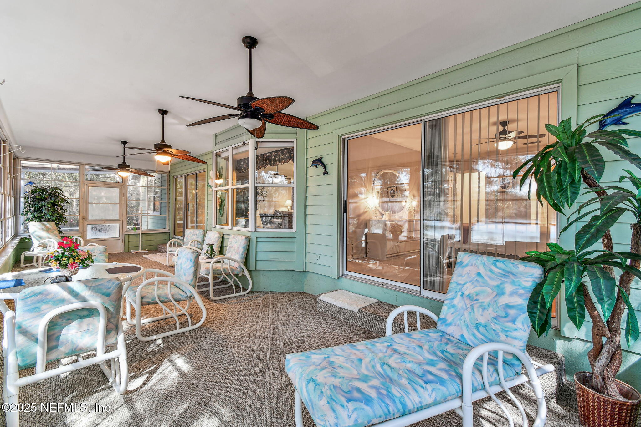 117 Gator Trail Melrose, FL 32666 - Photo 21 of 67 a living room filled with furniture and a chandelier