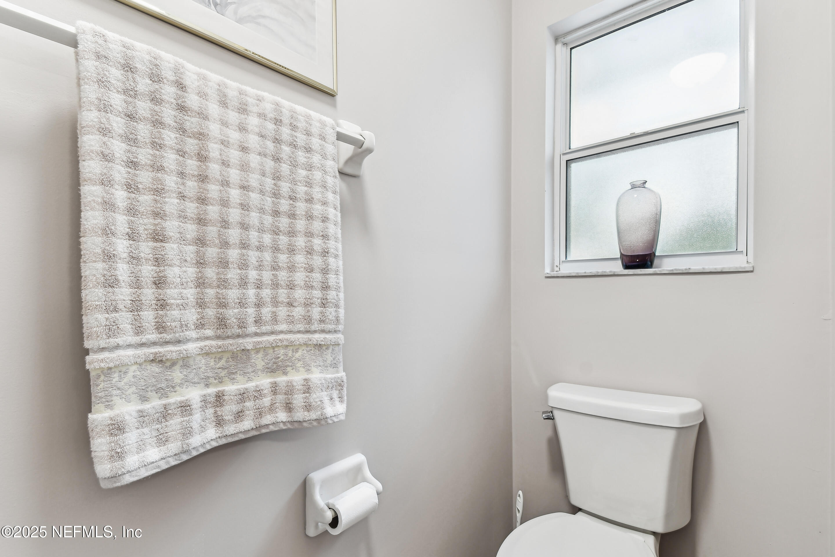 117 Gator Trail Melrose, FL 32666 - Photo 27 of 67 a white toilet sitting next to a bathroom sink