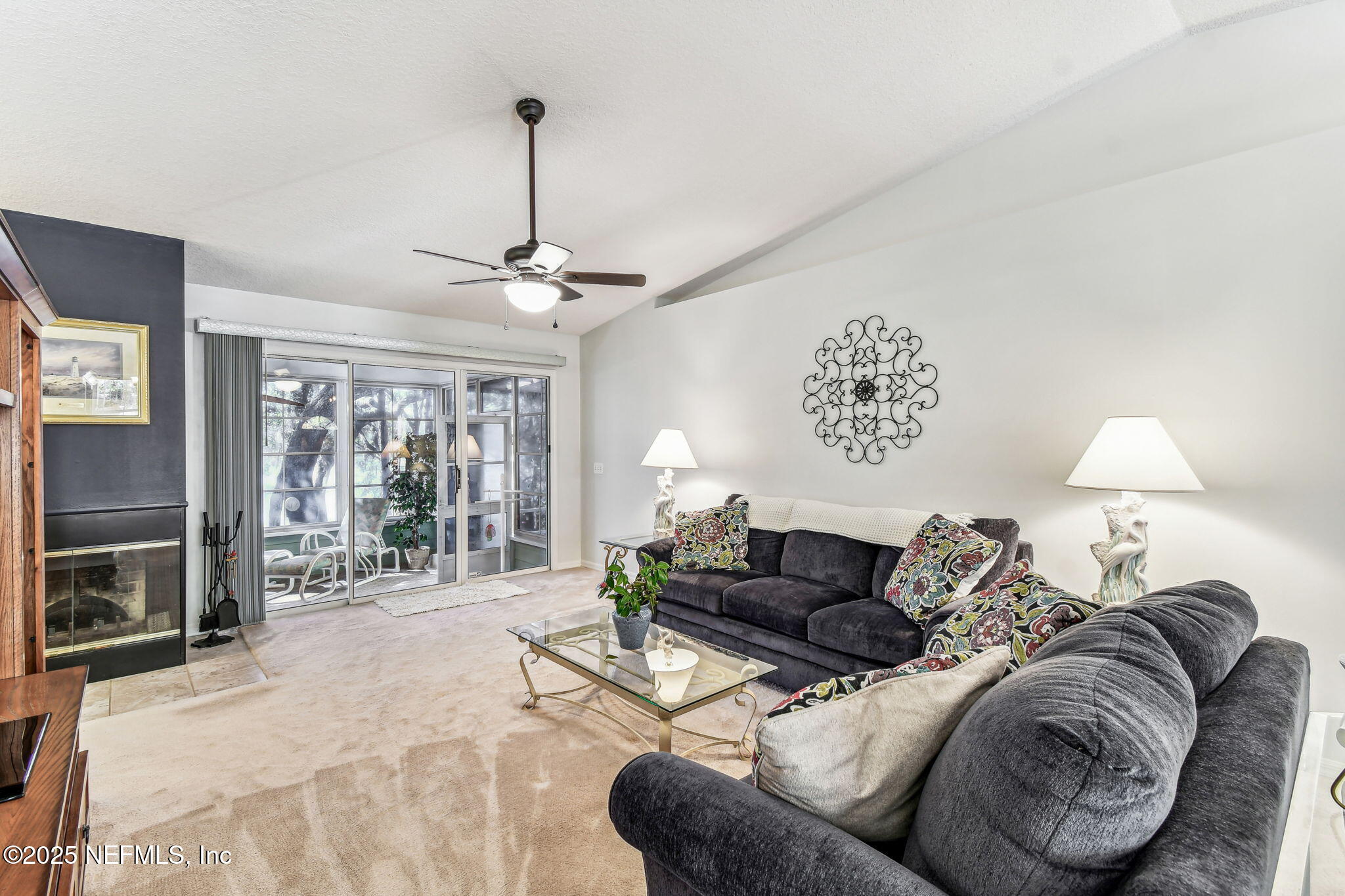 117 Gator Trail Melrose, FL 32666 - Photo 3 of 67 a living room with furniture a large window and a chandelier