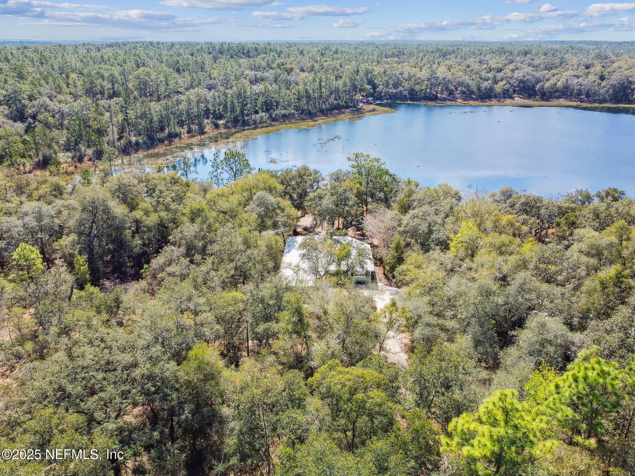 117 Gator Trail Melrose, FL 32666 - Photo 47 of 67 a view of a lake with a mountain in the background