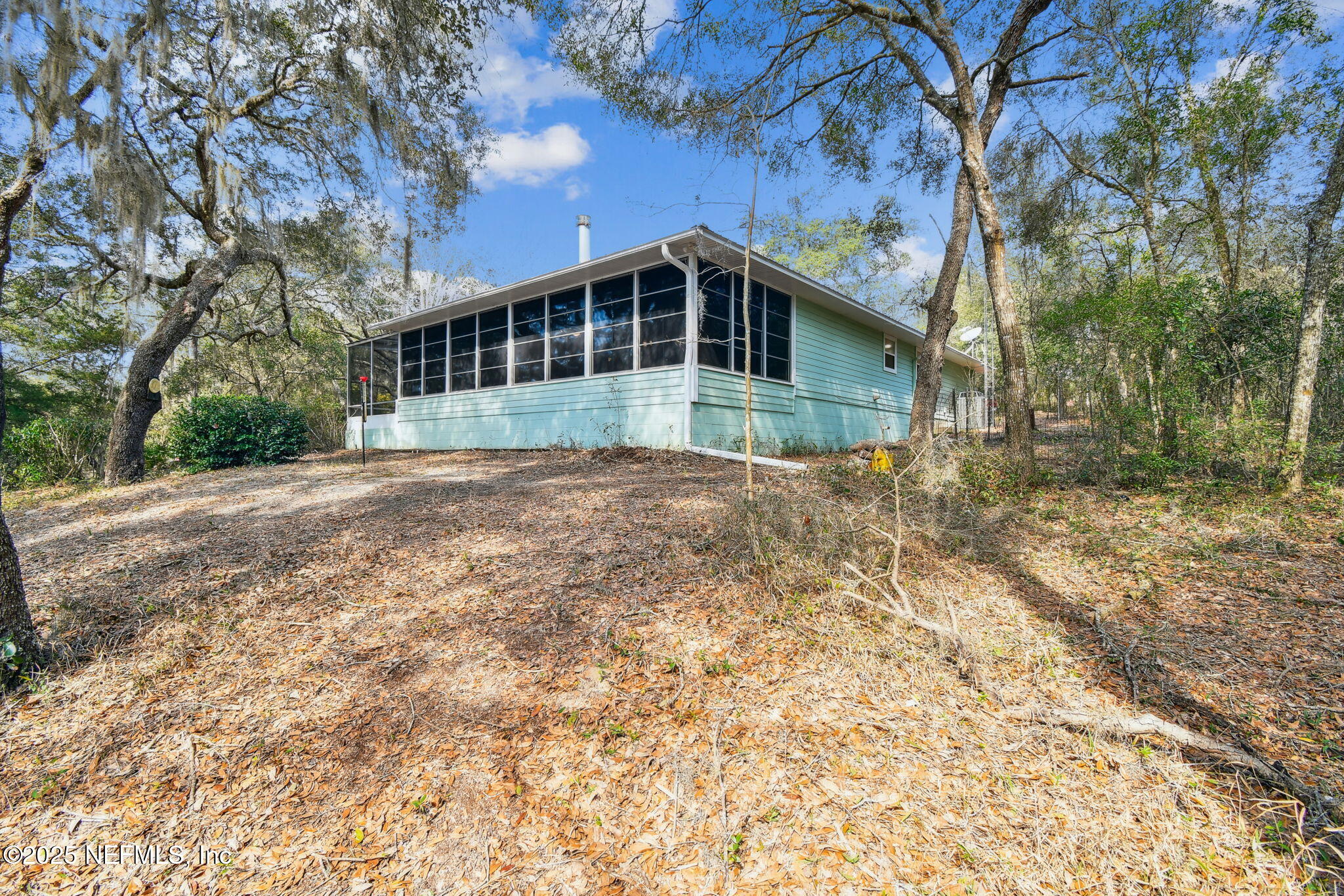 117 Gator Trail Melrose, FL 32666 - Photo 57 of 67 a front view of a house with a yard