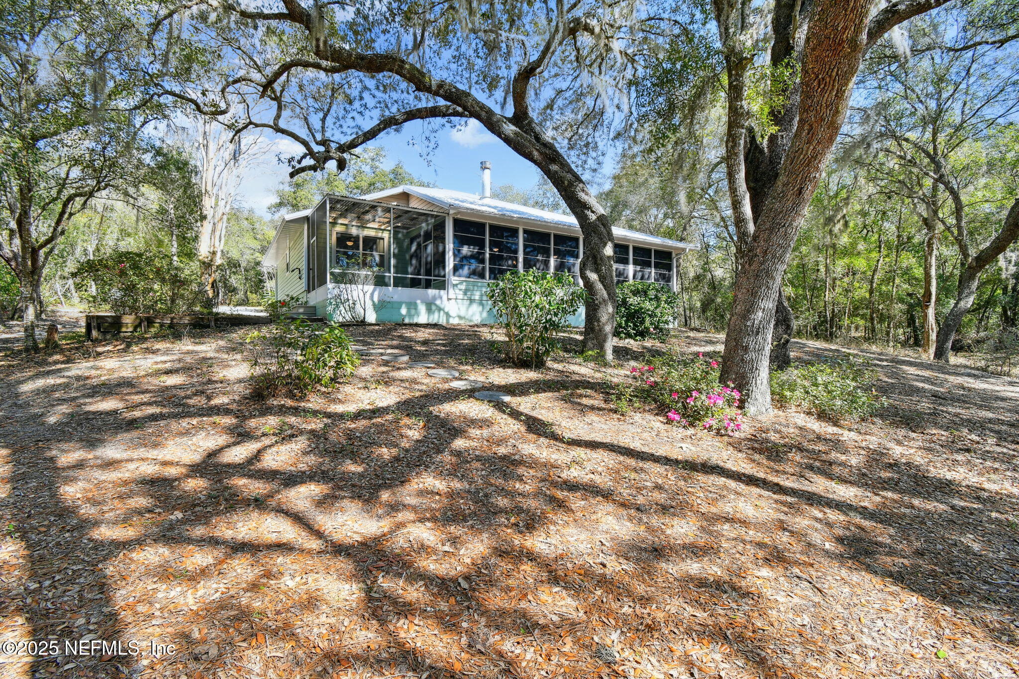 117 Gator Trail Melrose, FL 32666 - Photo 59 of 67 a view of a house with a tree in the yard