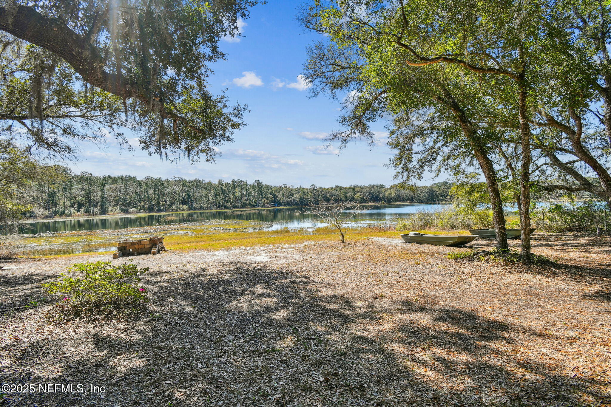 117 Gator Trail Melrose, FL 32666 - Photo 61 of 67 a view of a lake with houses in the background