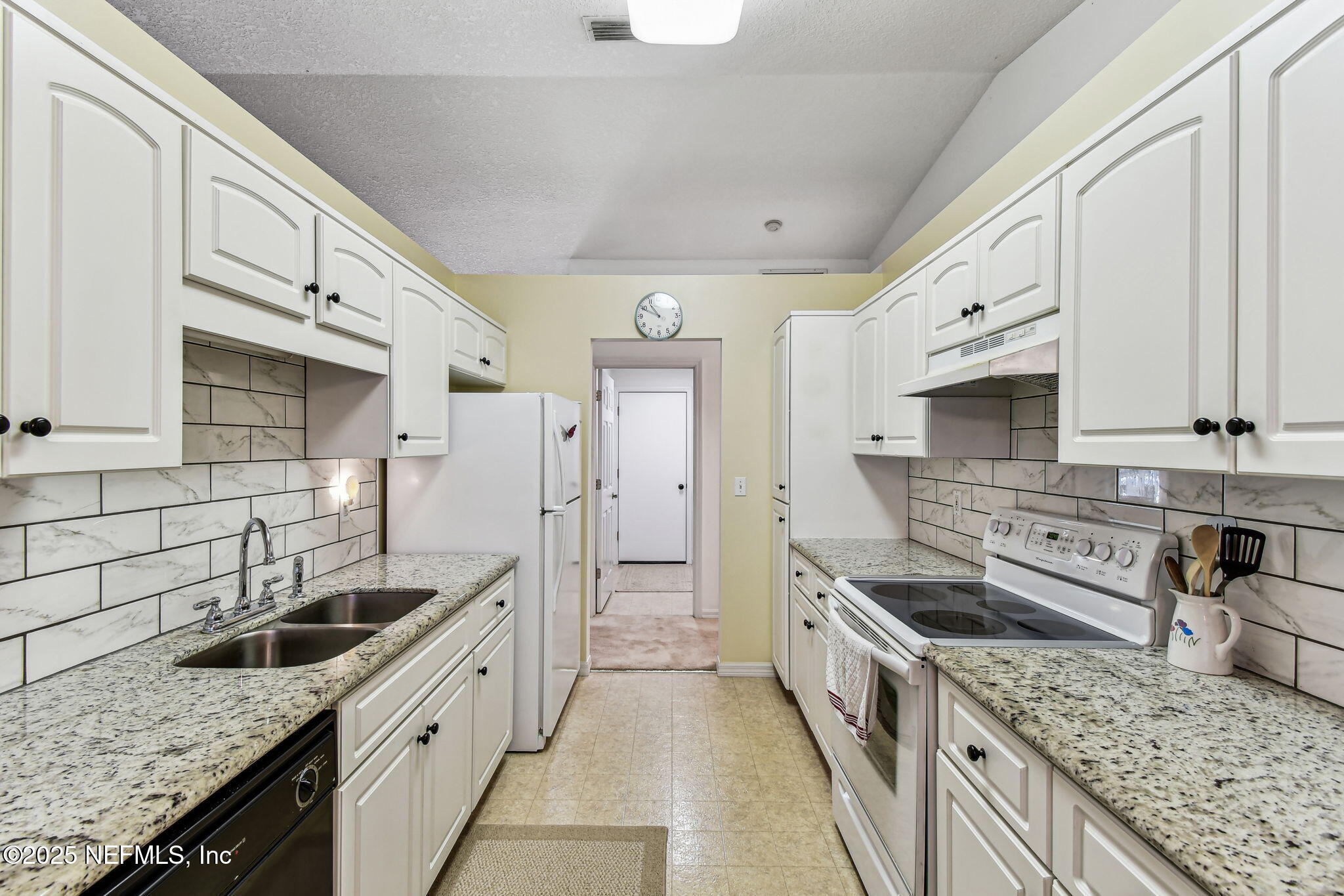 117 Gator Trail Melrose, FL 32666 - Photo 10 of 67 a kitchen with stainless steel appliances granite countertop a sink stove and refrigerator