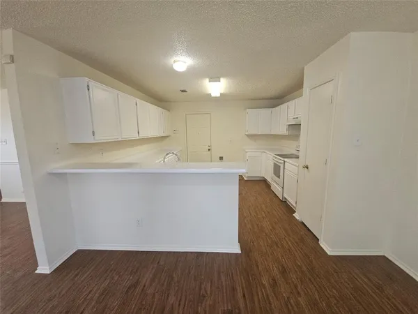 a view of kitchen with wooden floor
