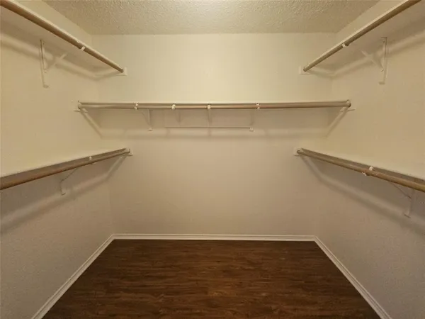 a view of an empty walk in closet