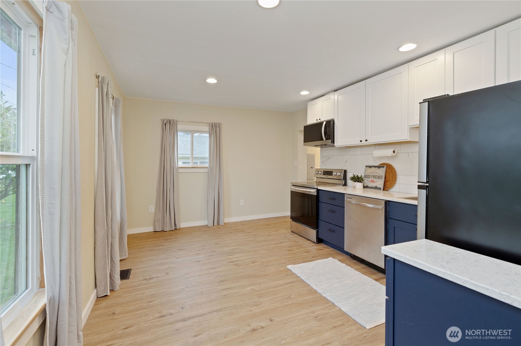 2013 8th Street Bremerton, WA 98337 - Photo 11 of 22 a kitchen with a refrigerator and a stove top oven