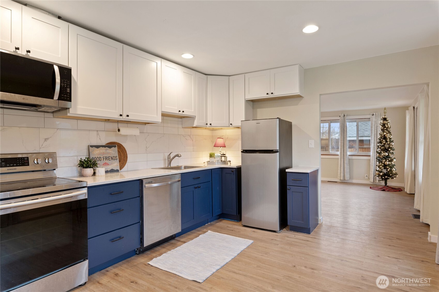 2013 8th Street Bremerton, WA 98337 - Photo 13 of 22 a kitchen with stainless steel appliances granite countertop a refrigerator stove top oven and sink