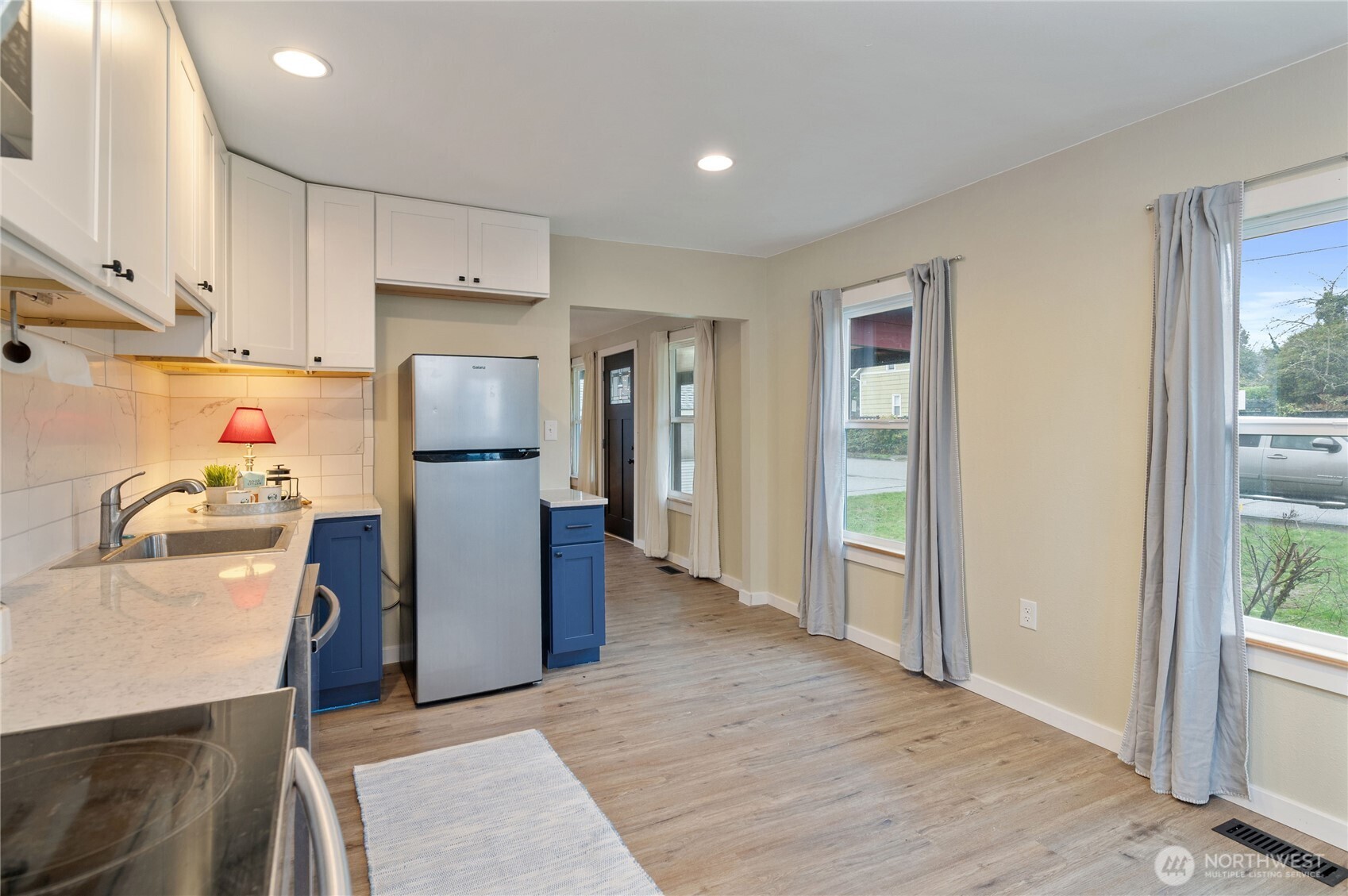 2013 8th Street Bremerton, WA 98337 - Photo 14 of 22 a kitchen with stainless steel appliances a refrigerator and a sink