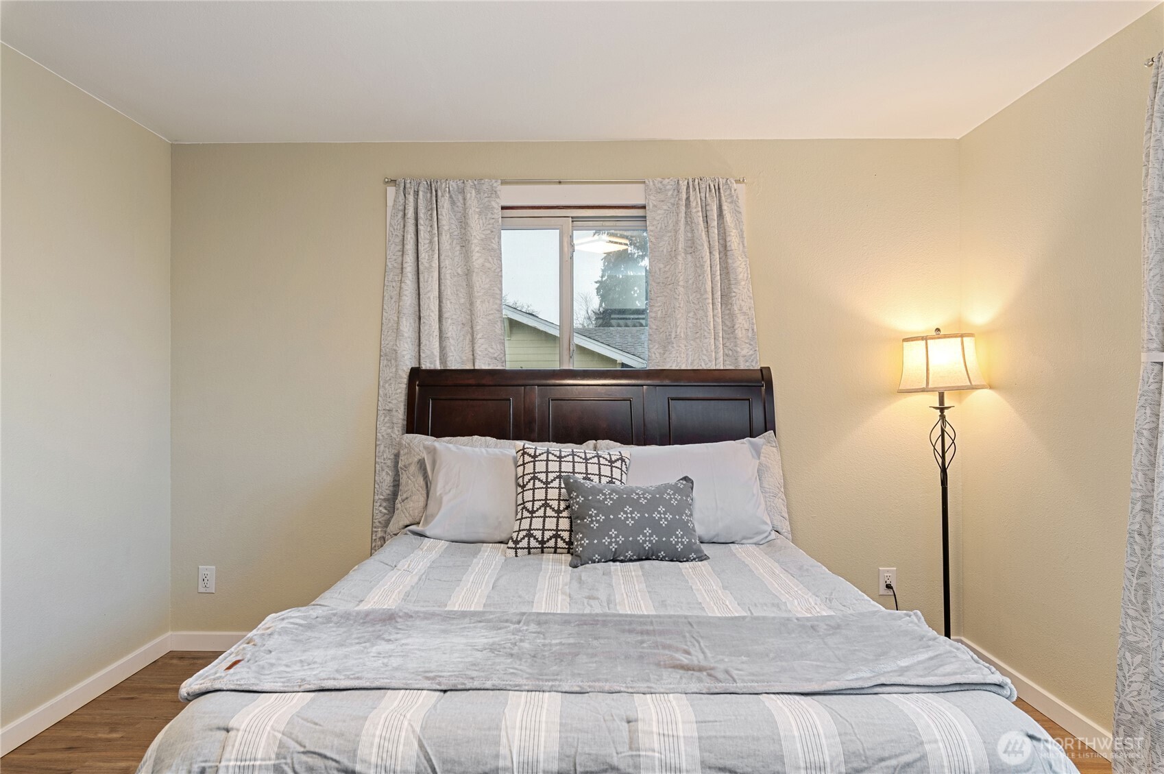 2013 8th Street Bremerton, WA 98337 - Photo 17 of 22 a bed sitting in a bedroom next to a window