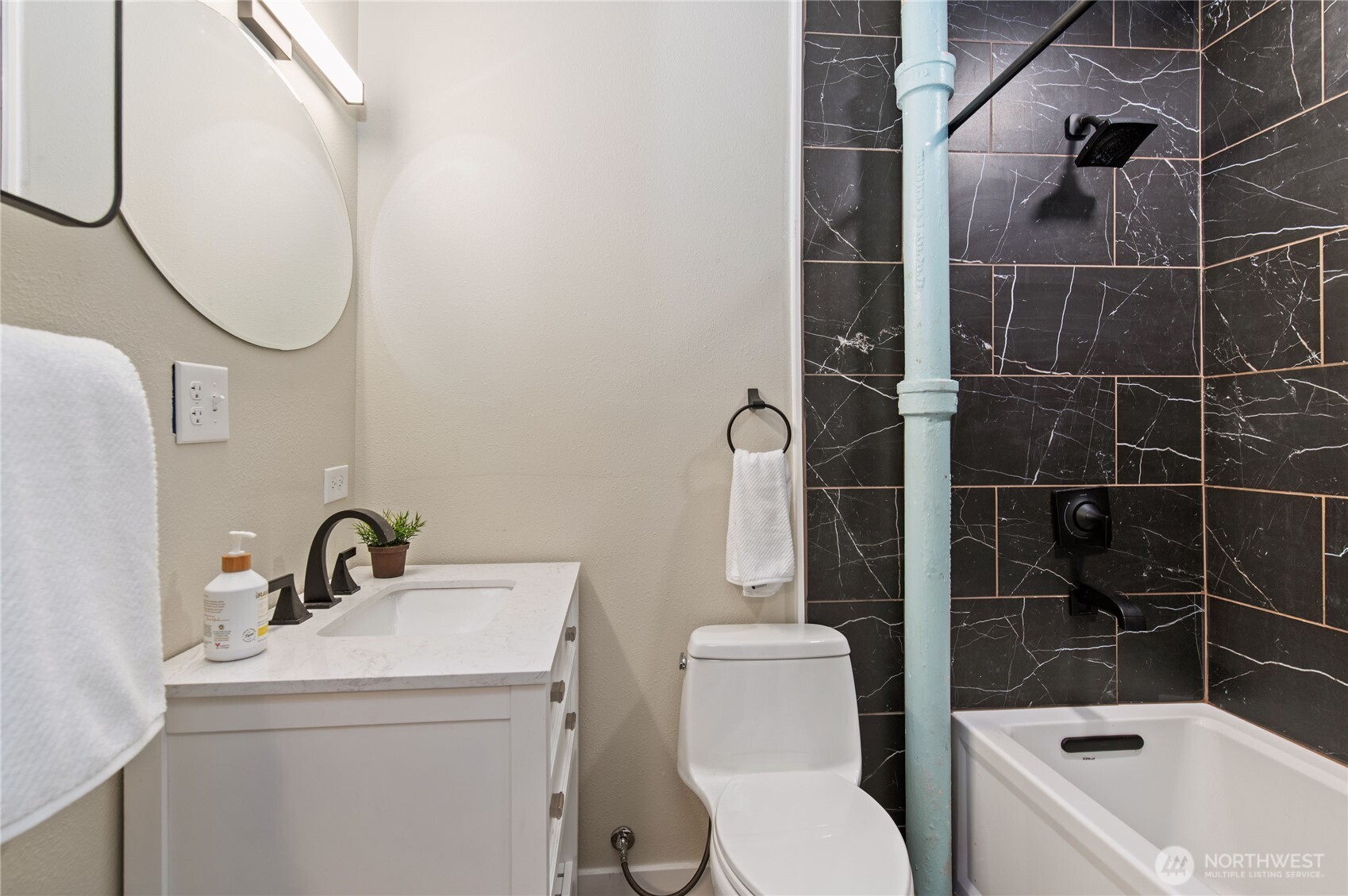 2013 8th Street Bremerton, WA 98337 - Photo 18 of 22 a bathroom with a sink toilet and shower