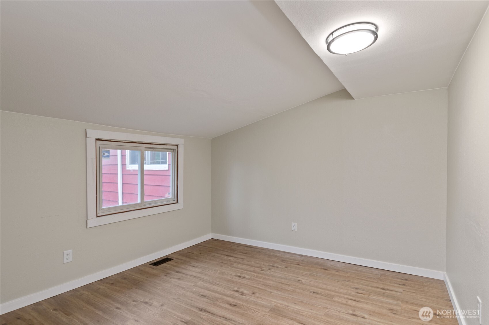 2013 8th Street Bremerton, WA 98337 - Photo 20 of 22 an empty room with wooden floor and windows