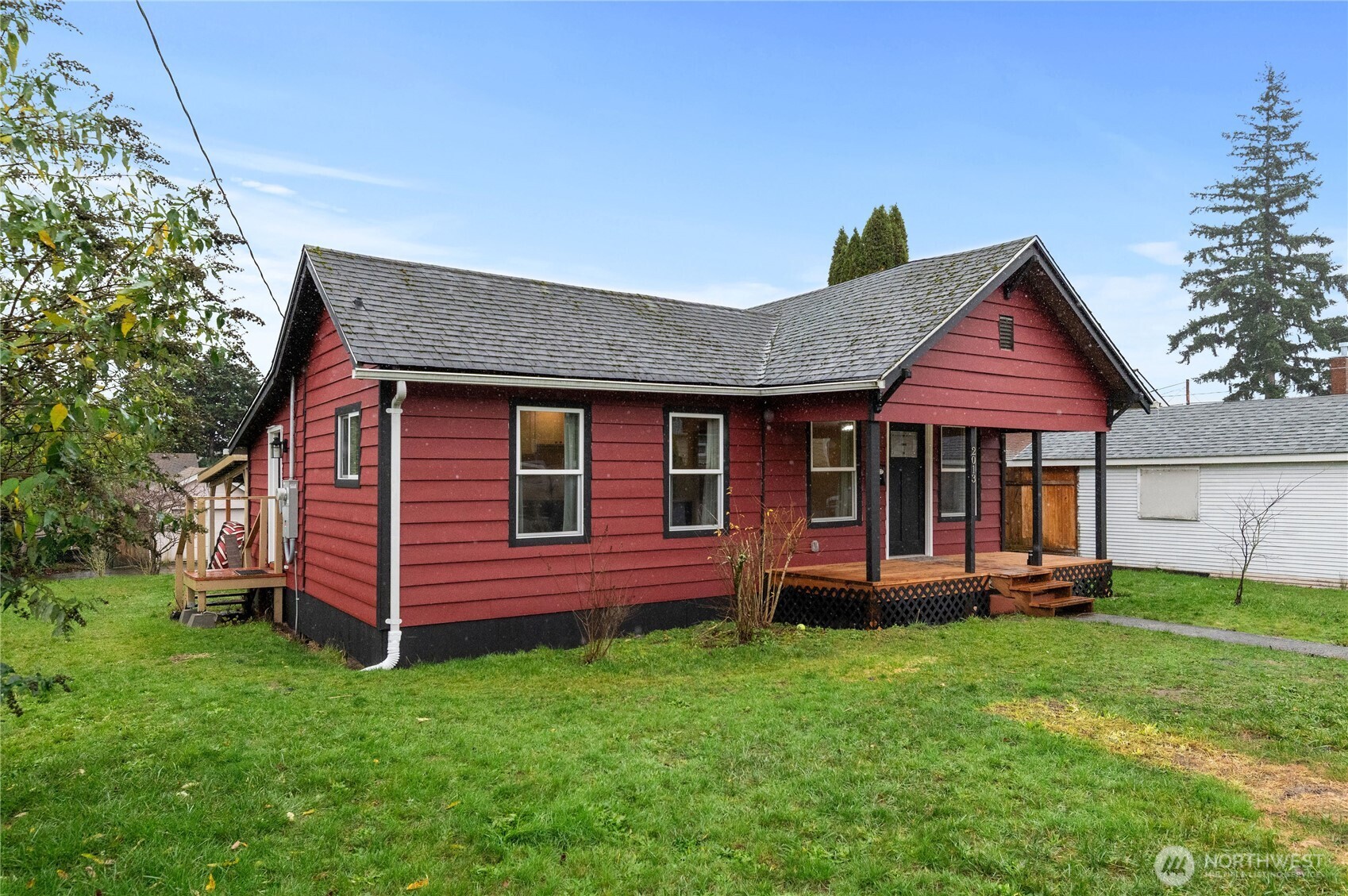2013 8th Street Bremerton, WA 98337 - Photo 2 of 22 a front view of a house with a garden and deck