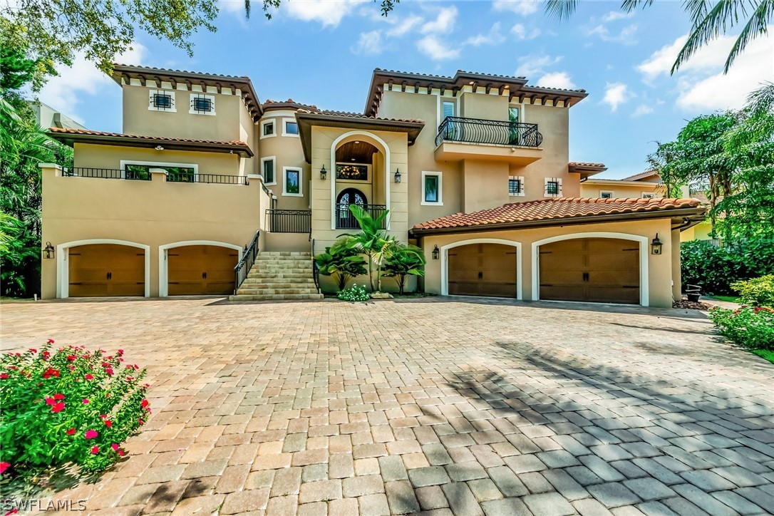 8347 Midnight Pass Road Sarasota, FL 34242 - Photo 1 of 34 a front view of a building with garden