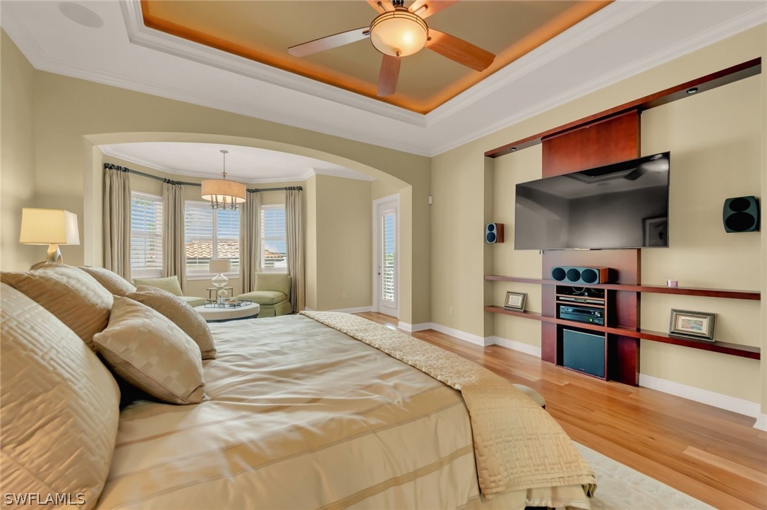 8347 Midnight Pass Road Sarasota, FL 34242 - Photo 22 of 34 a bedroom with a bed and a television