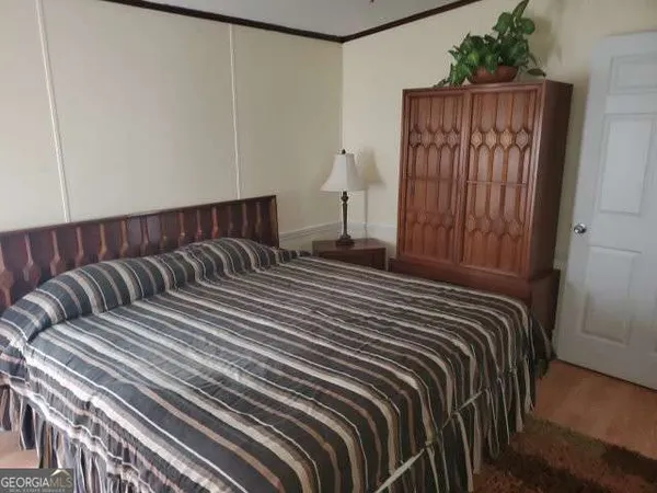 a bedroom with a bed and a closet