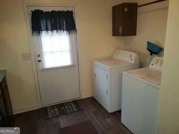a utility room with dryer and washer