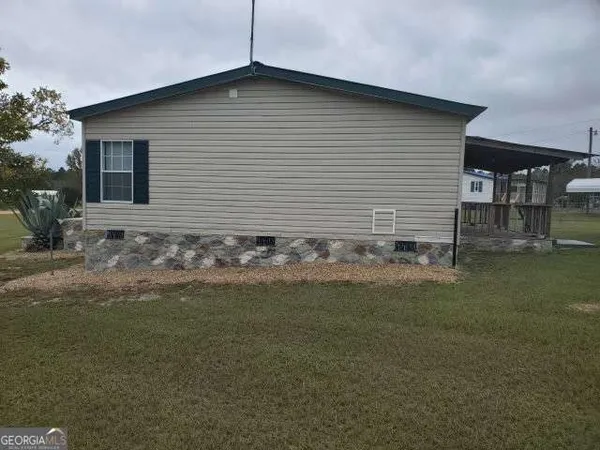 a front view of house with garden