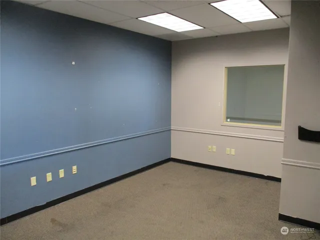 a view of a room that has a large window