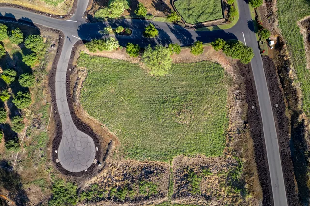 a view of a swimming pool with a yard