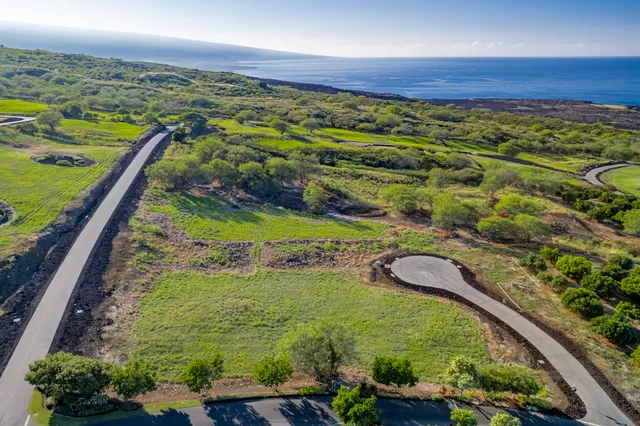 a view of a lake with a yard