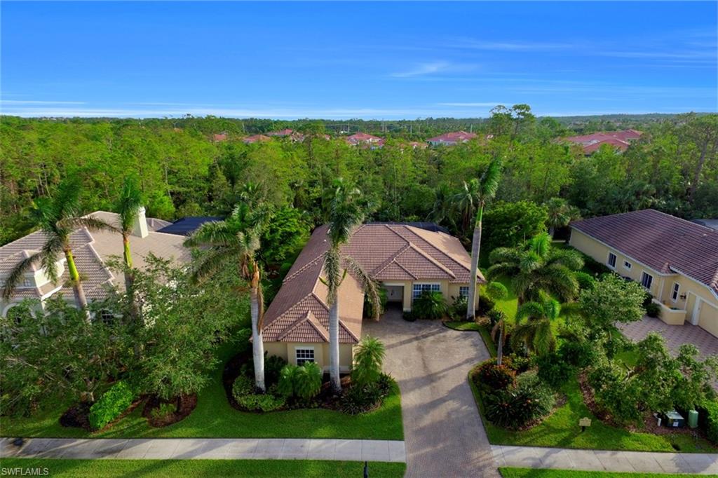 7856 Classics Drive Naples, FL 34113 - Photo 1 of 25 a view of a garden with houses
