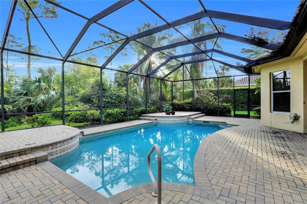 7856 Classics Drive Naples, FL 34113 - Photo 22 of 25 a view of swimming pool with a patio