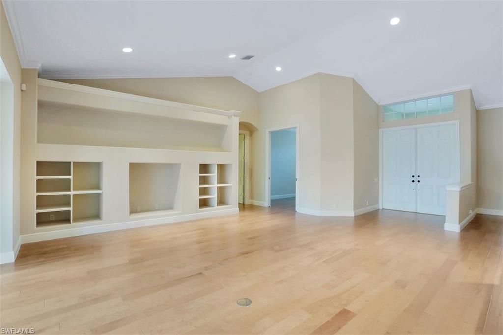 7856 Classics Drive Naples, FL 34113 - Photo 3 of 25 an empty room with a empty space and windows