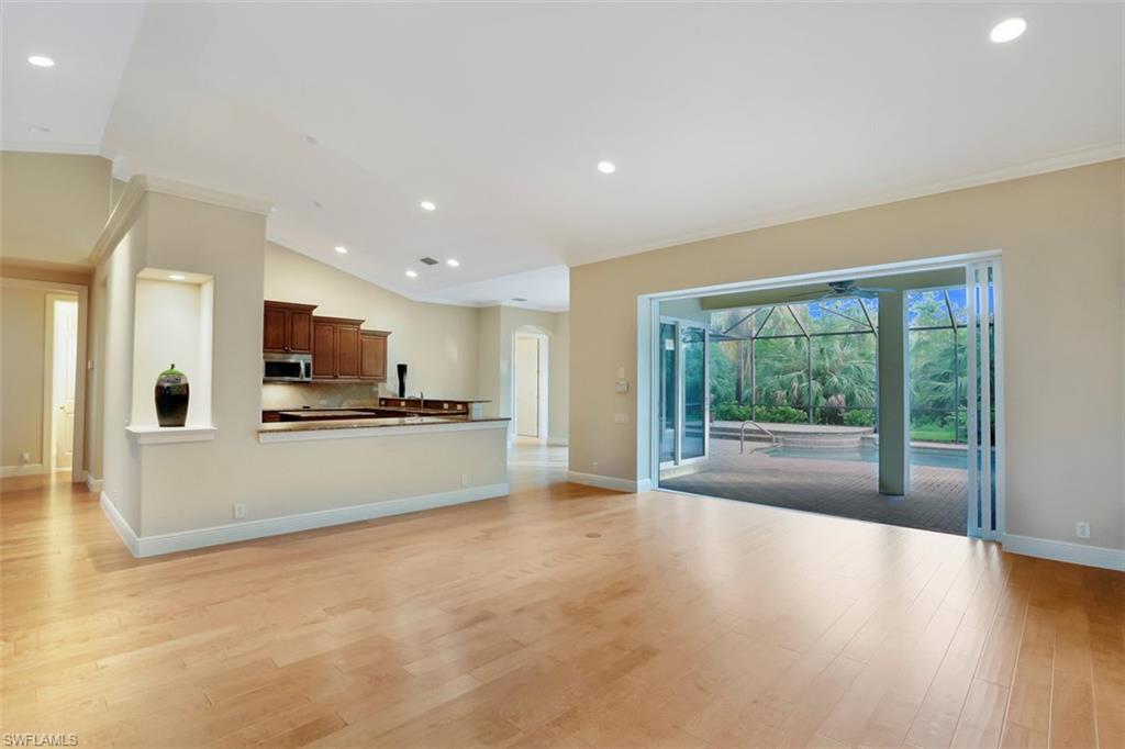 7856 Classics Drive Naples, FL 34113 - Photo 5 of 25 a view of a kitchen with a sink and a stove top oven