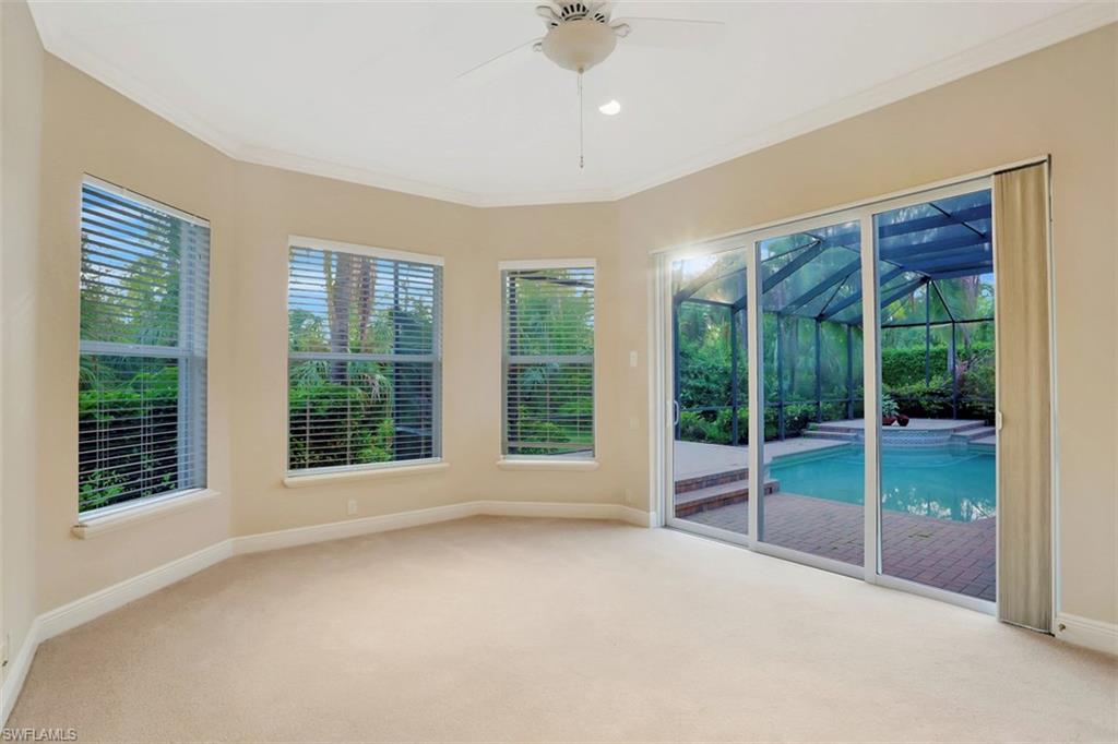 7856 Classics Drive Naples, FL 34113 - Photo 8 of 25 a view of an empty room with windows and closet
