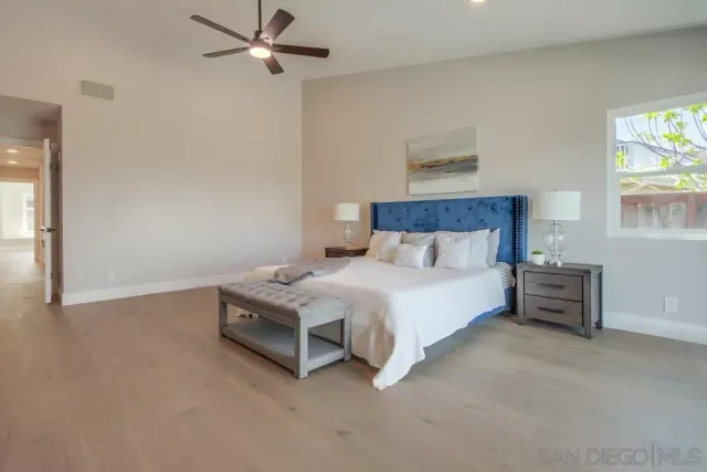 a view of a patio with a table and chairs under an umbrella with wooden floor