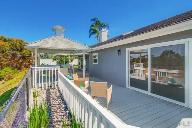 a bathroom with a double vanity sink toilet mirror and bathtub