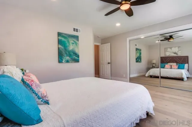 a view of an outdoor dining space with a table and chairs