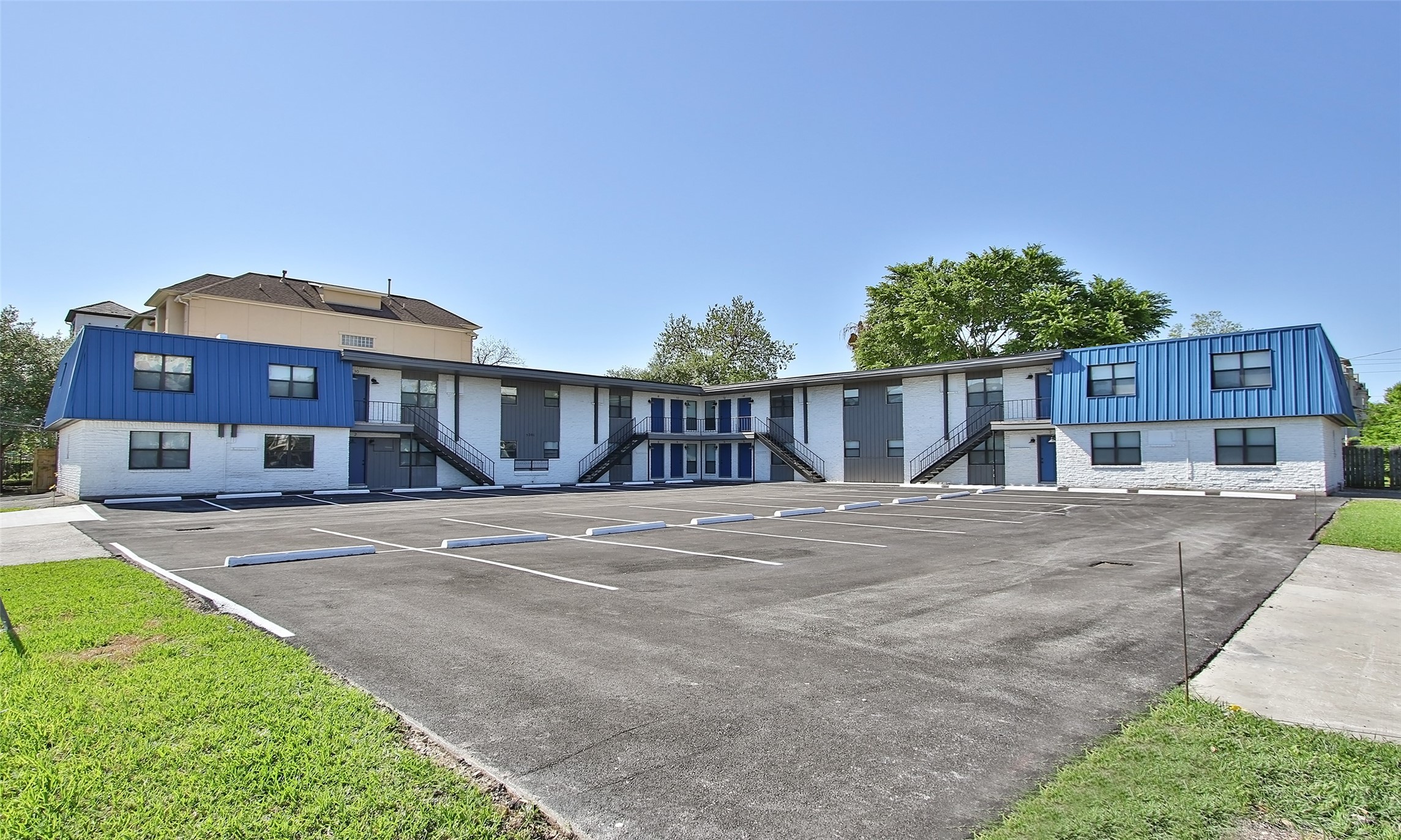 5201 Crawford Street, Unit 5 Houston, TX 77004 - Photo 10 of 10 a front view of a house with a yard and garage
