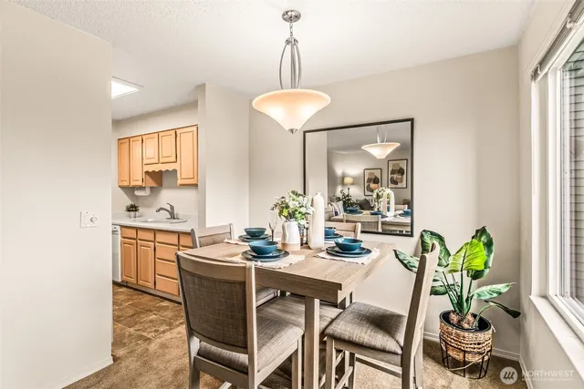 a dining room with furniture and window