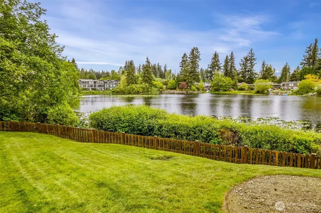 a view of a lake with a yard