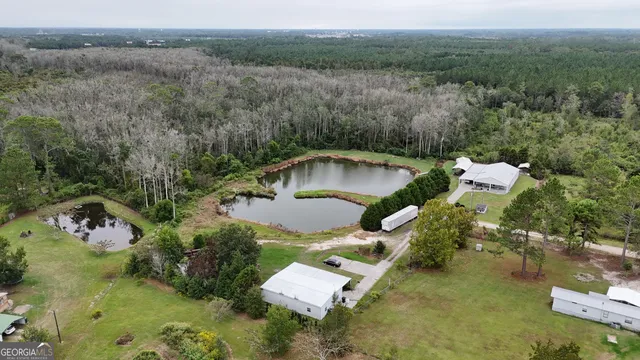 an aerial view of a house with pool
