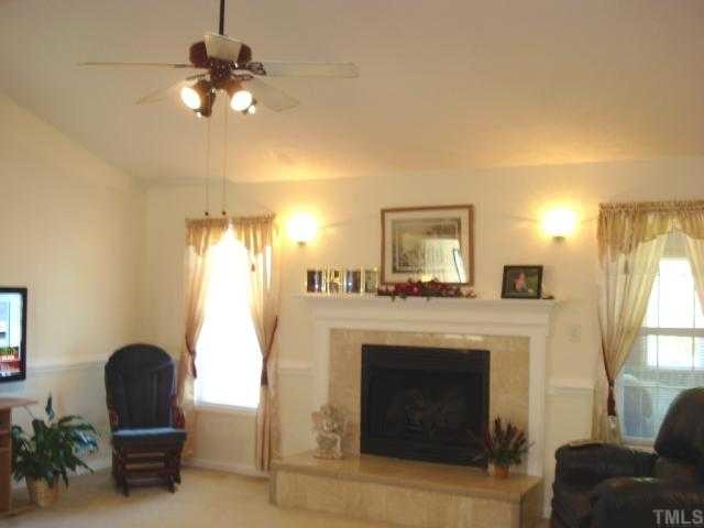 5845 Covered Bridge Road Clayton, NC 27527 - Photo 3 of 11 GORGEOUS Family Room with a VAULTED ceiling, RAISED HEARTH, GAS LOG fireplace and CHAIR molding!