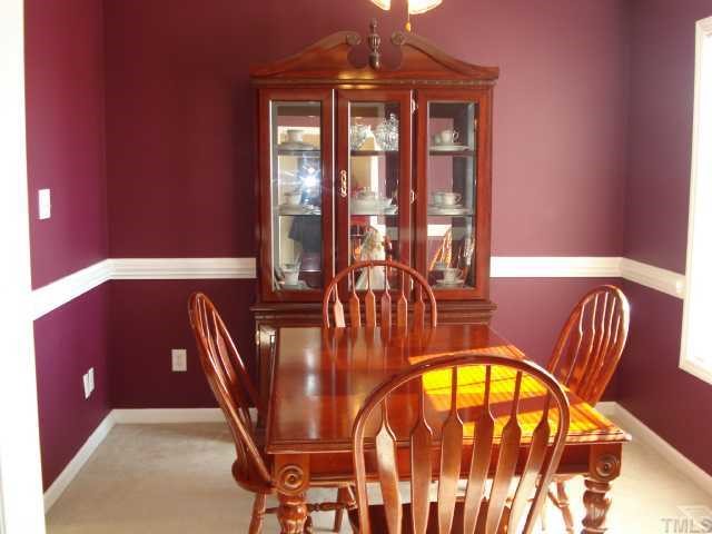 5845 Covered Bridge Road Clayton, NC 27527 - Photo 7 of 11 SEPARATE Dining Room with Cranberry shaded walls and CHAIR RAIL molding!