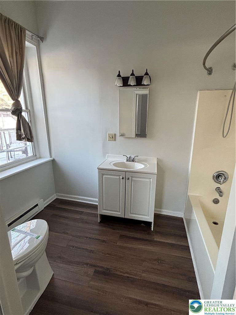 350 Main Street, Unit 5 Slatington, PA 18080 - Photo 15 of 18 a room with a wooden floor and a sink