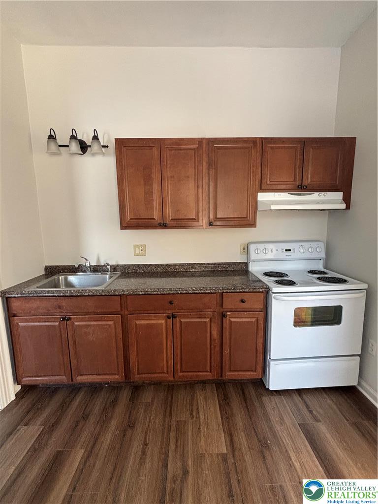 350 Main Street, Unit 5 Slatington, PA 18080 - Photo 7 of 18 a kitchen with granite countertop white cabinets and white appliances