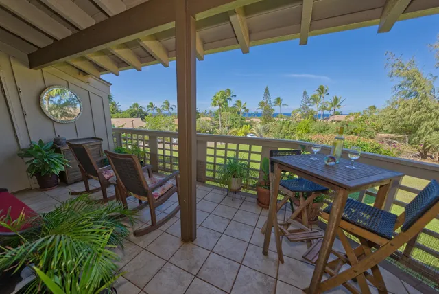 a view of a patio with table and chairs and potted plants