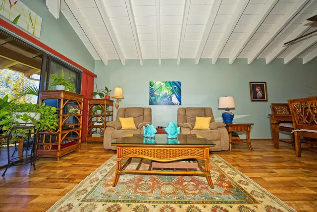 a living room filled with furniture and a rug