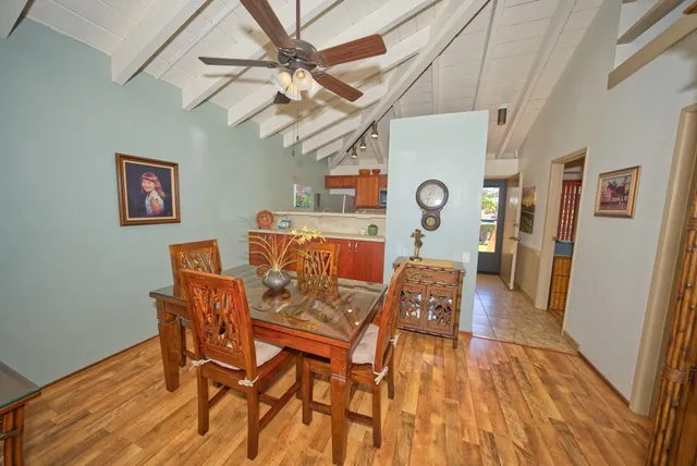 a view of a dining room with furniture and wooden floor
