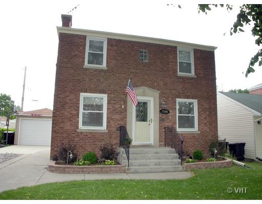 7348 West Rascher Avenue Chicago, IL 60656 - Photo 1 of 1 a front view of a house with a yard