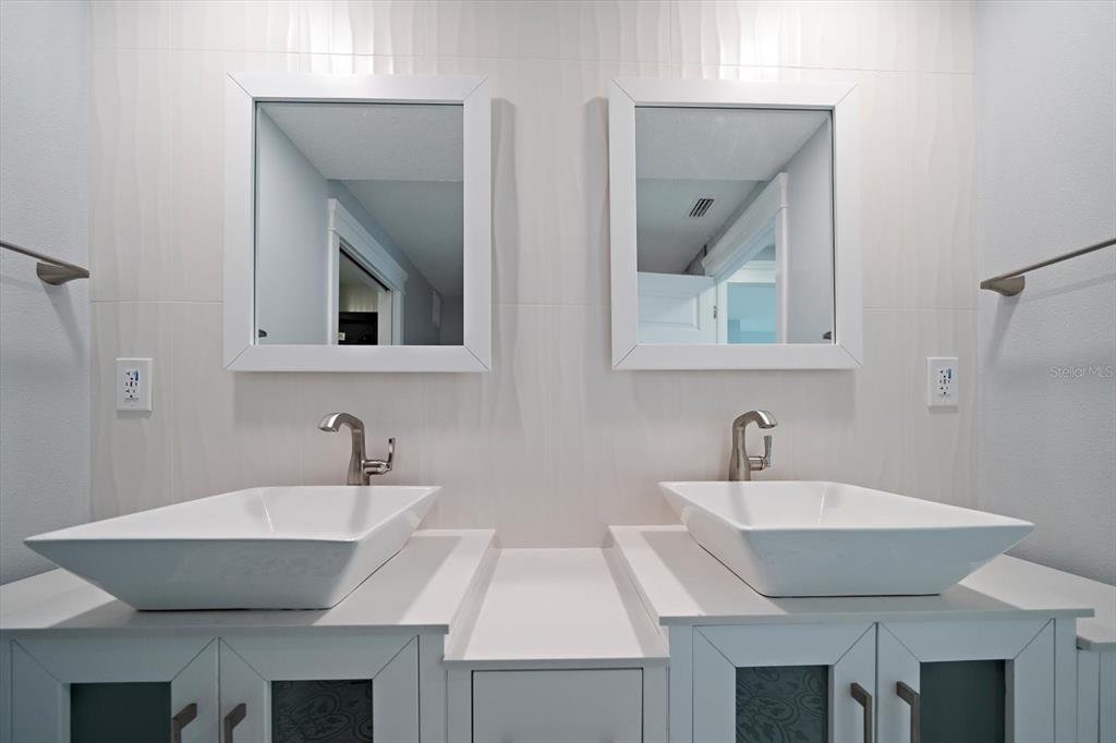 50 Coe Road, Unit 125 Belleair, FL 33756 - Photo 41 of 67 a bathroom with a sink and a mirror