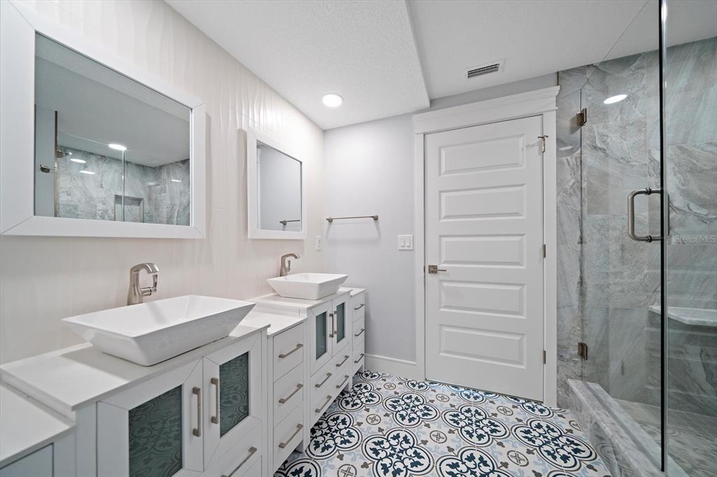 50 Coe Road, Unit 125 Belleair, FL 33756 - Photo 47 of 67 a bathroom with a sink and a mirror