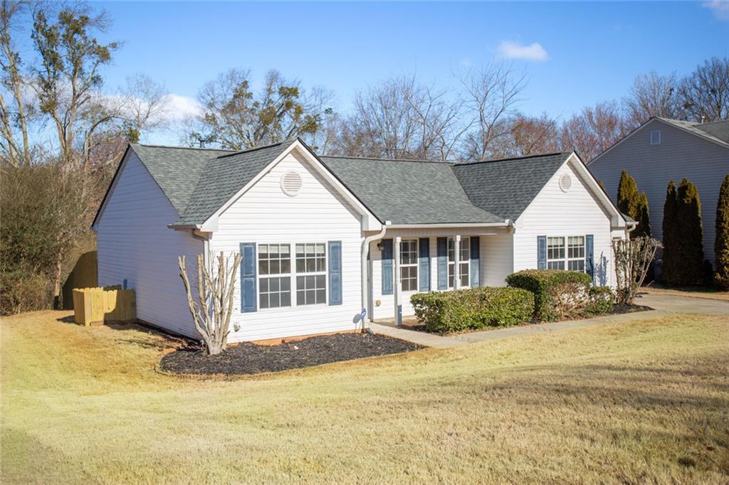425 Shenandoah Court Winder, GA 30680 - Photo 17 of 17 a front view of a house with a yard and garage