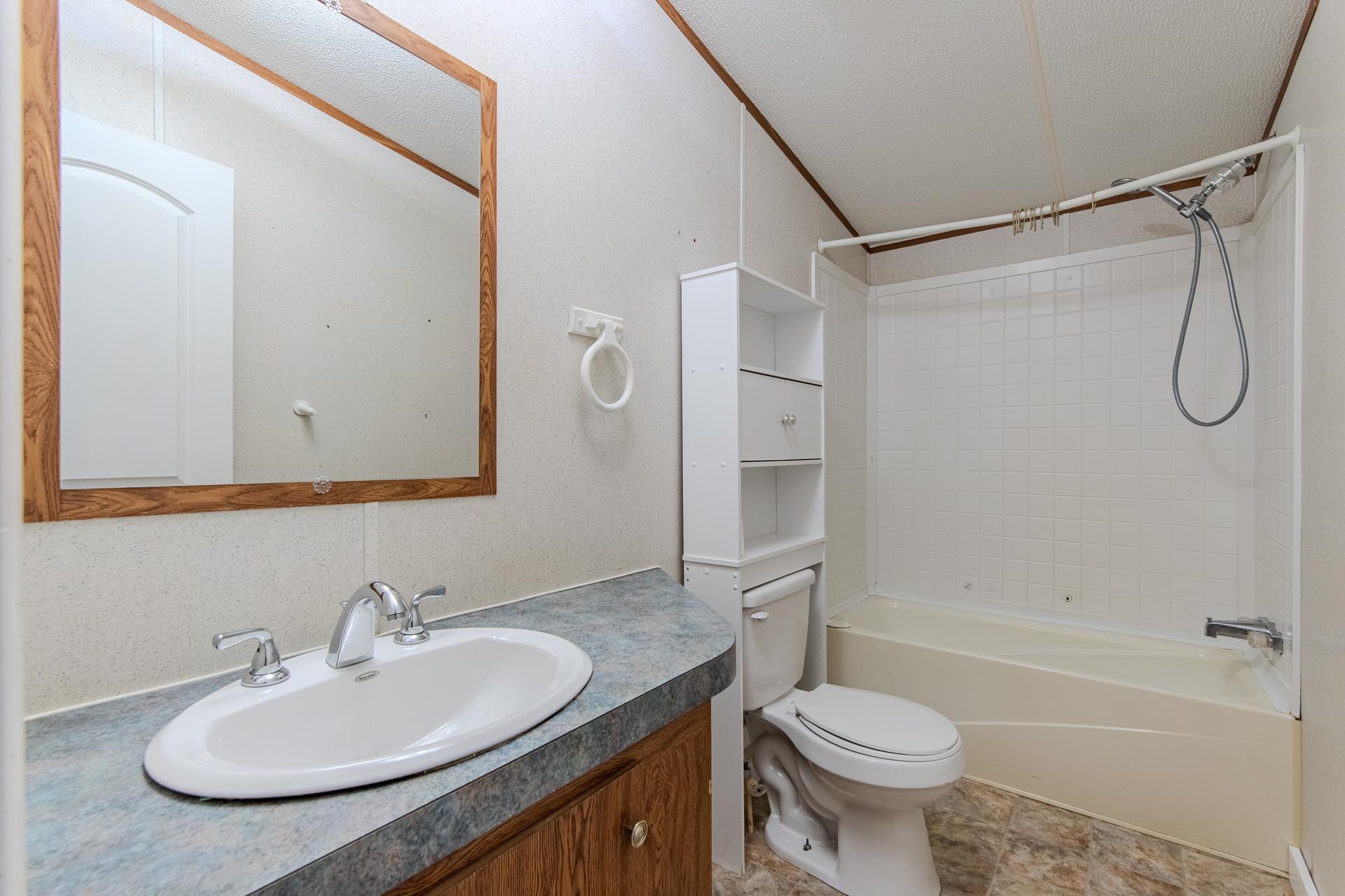 23 Old Ferry Road Bath Springs, TN 38311 - Photo 14 of 40 a bathroom with a sink toilet and shower