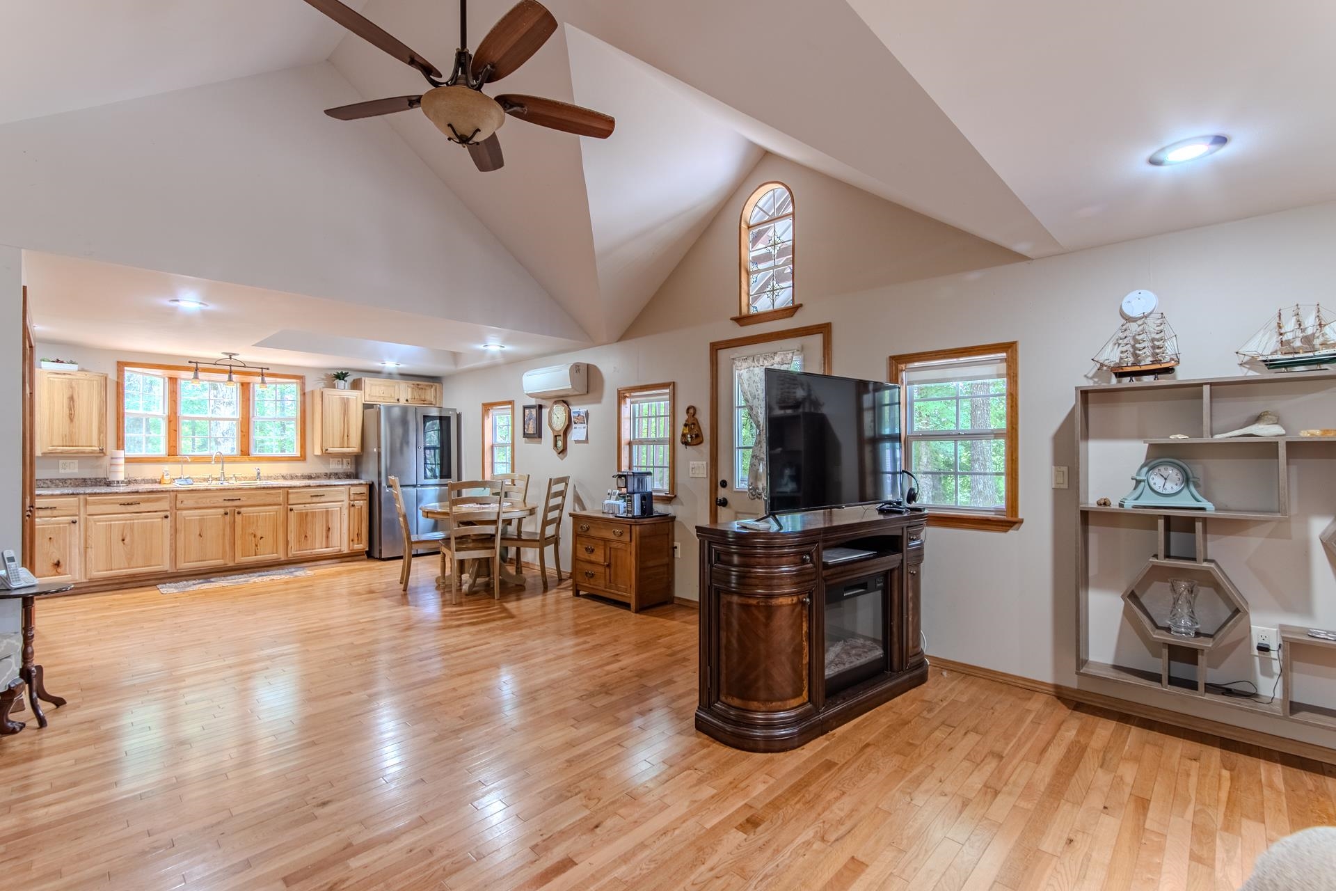 23 Old Ferry Road Bath Springs, TN 38311 - Photo 21 of 40 a view of a kitchen with furniture a ceiling fan and wooden floor